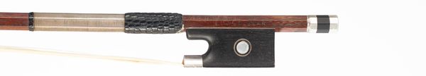 A silver-mounted violin bow, branded A Bacelar