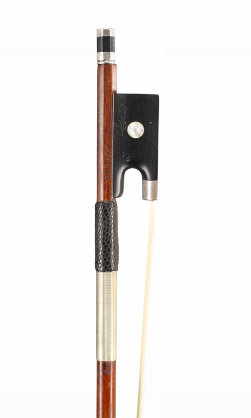 A silver-mounted violin bow, branded Tourte