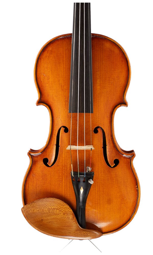 A violin, labelled Giuseppe Saretta