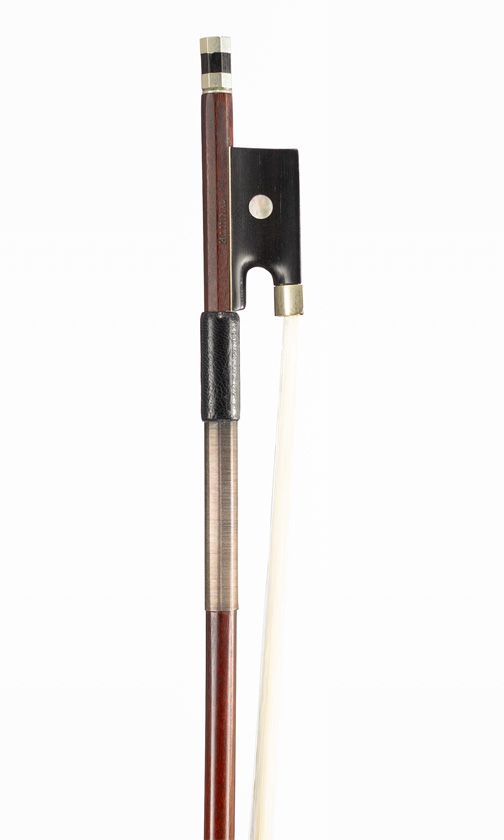 A nickel-mounted violin bow, branded Tourte