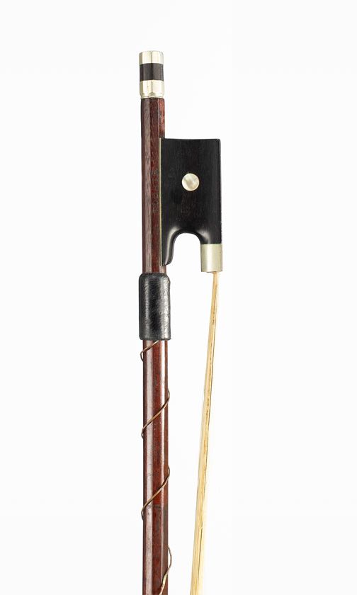 A nickel-mounted violin bow, branded Tourte