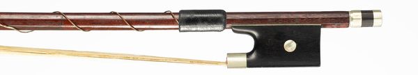 A nickel-mounted violin bow, branded Tourte
