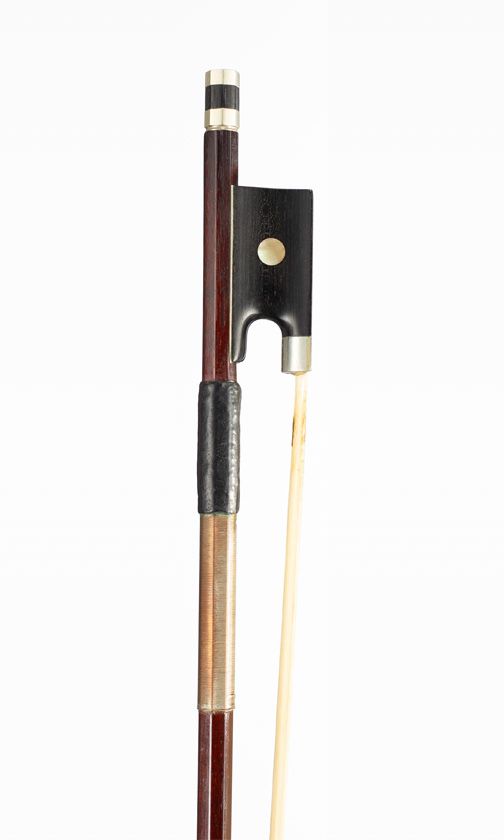 A nickel-mounted violin bow, branded Tourte