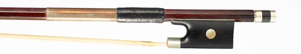 A nickel-mounted violin bow, branded Tourte
