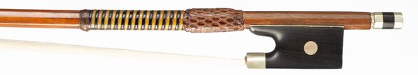 A nickel-mounted violin bow, branded Tourte