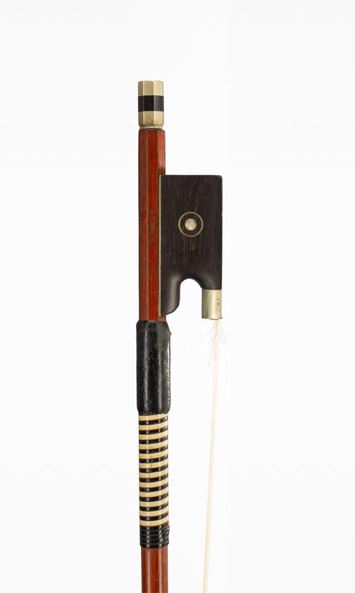 A nickel-mounted violin bow, branded W. Prell