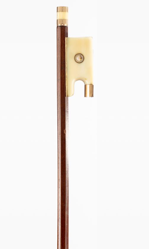 A gold-mounted violin bow, branded P. C.