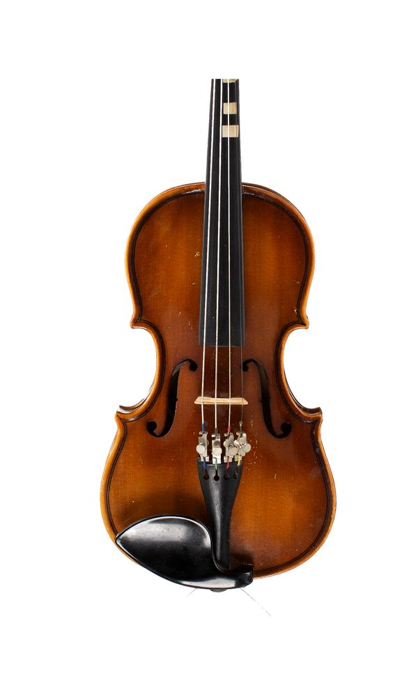 A small violin, labelled Boosey & Hawkes