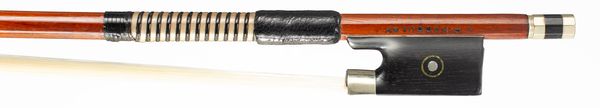 A nickel-mounted violin bow, branded J. Pikadoulak