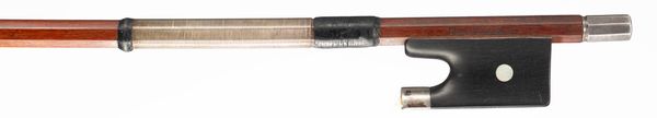 A silver-mounted violin bow, branded Tourte