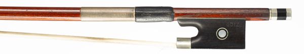 A nickel-mounted violin bow branded Gotz
