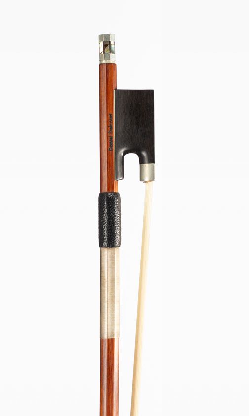 A nickel-mounted violin bow, branded Daniel Delcourt