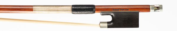 A nickel-mounted violin bow, branded Daniel Delcourt