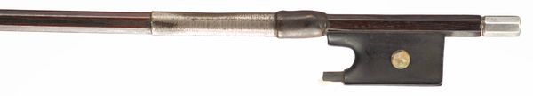 A silver-mounted violin bow, branded Tourte