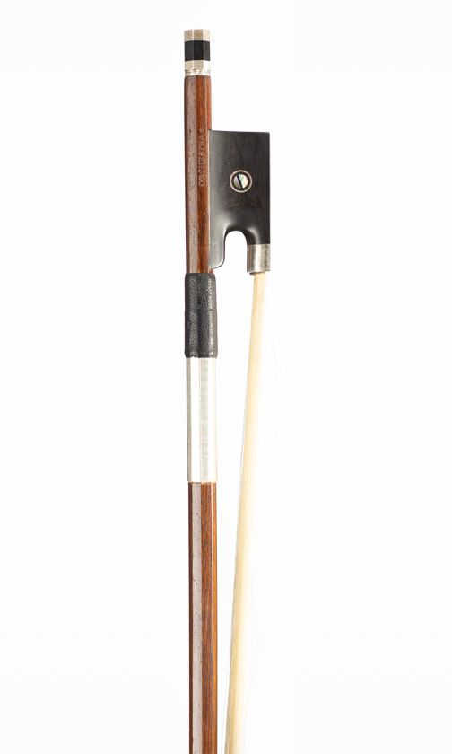 A nickel-mounted violin bow, branded Orchestra