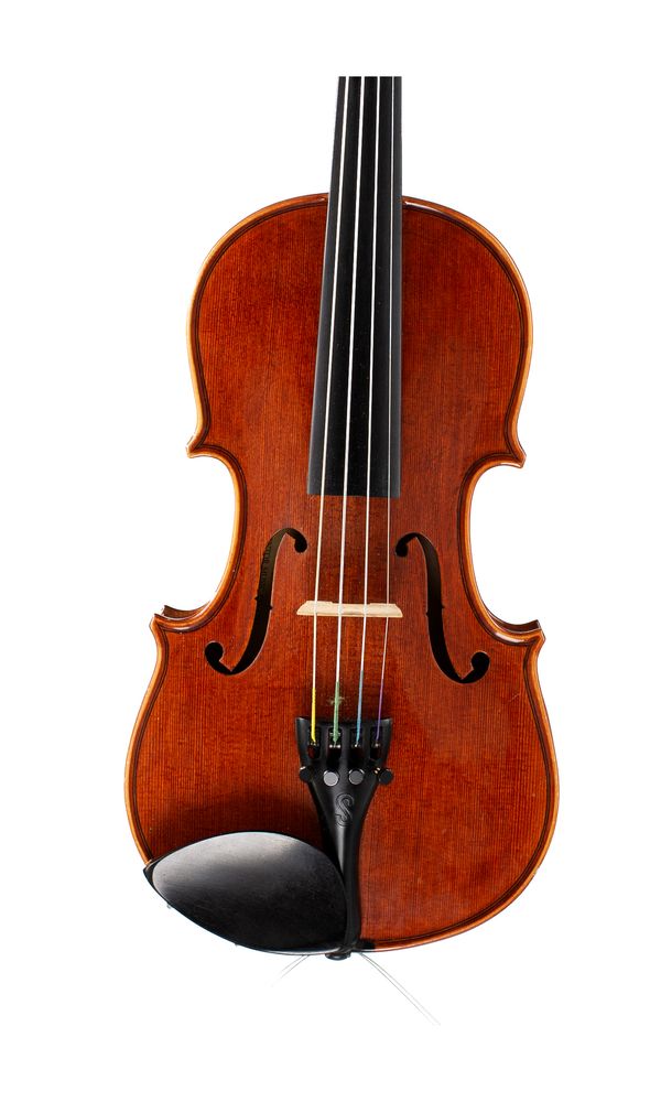 A half-sized violin, labelled The Stentor Conservatoire