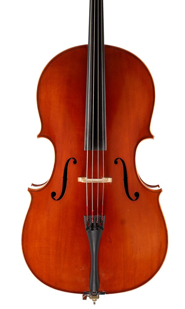 A half-sized cello, labelled Atelier de Lutherie