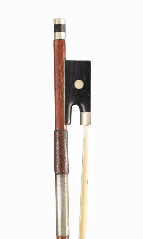 A nickel-mounted violin bow, branded Vtor Fetique A Paris