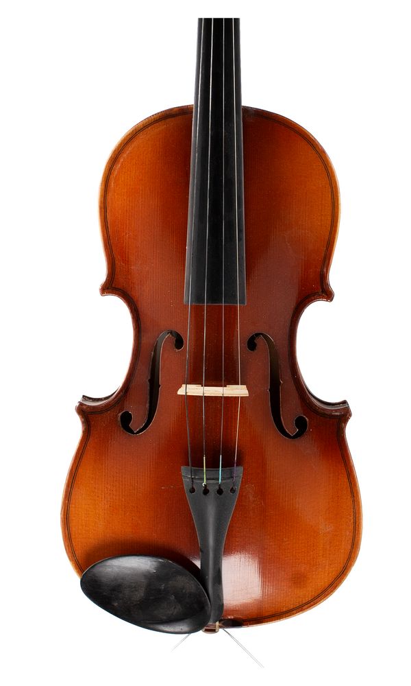 A three-quarter sized violin, labelled Skylark