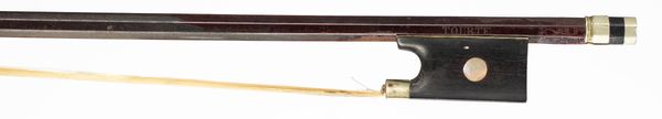 A nickel-mounted violin bow, branded Tourte