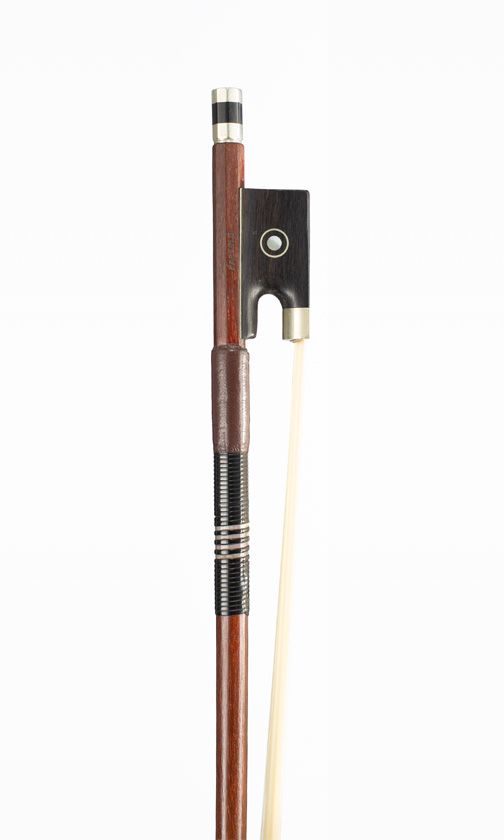 A child-sized nickel-mounted violin bow, branded Paesold