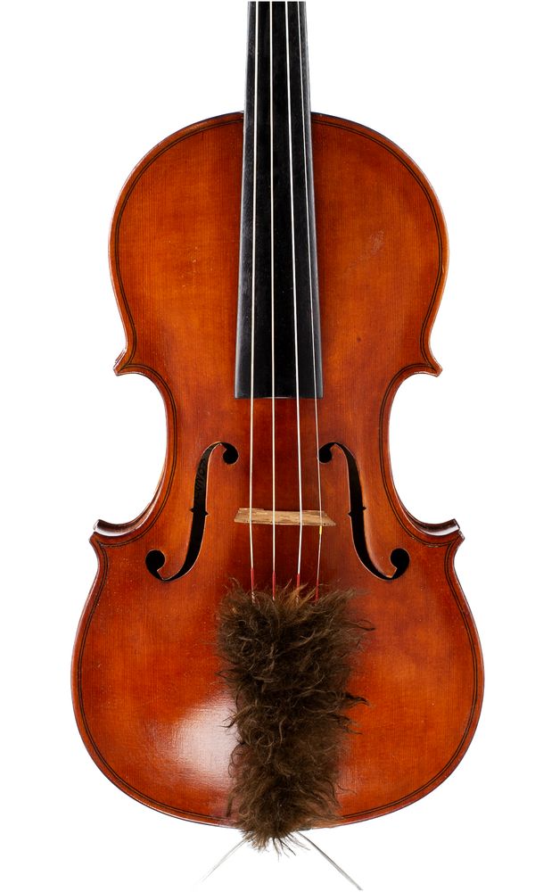 A violin, labelled Eric Taylor