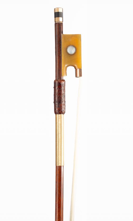 A gold-mounted violin bow, faintly branded Kittel