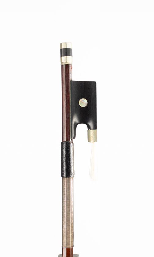 A nickel-mounted violin bow, branded Tourte