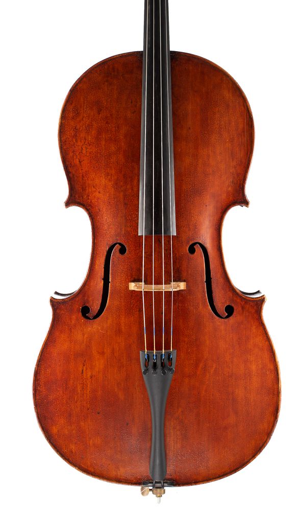 A cello, labelled Thos. Kennedy