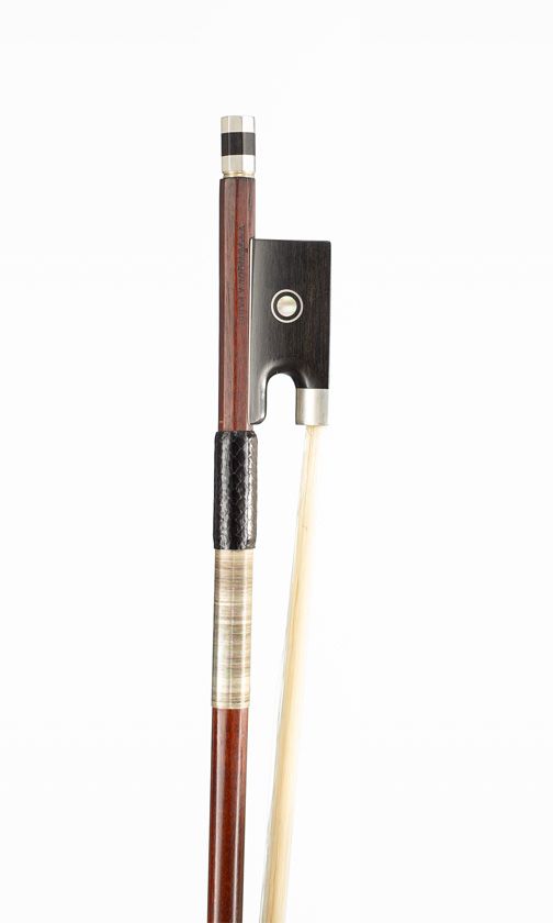 A silver-mounted violin bow, branded Vtor Fetique a Paris