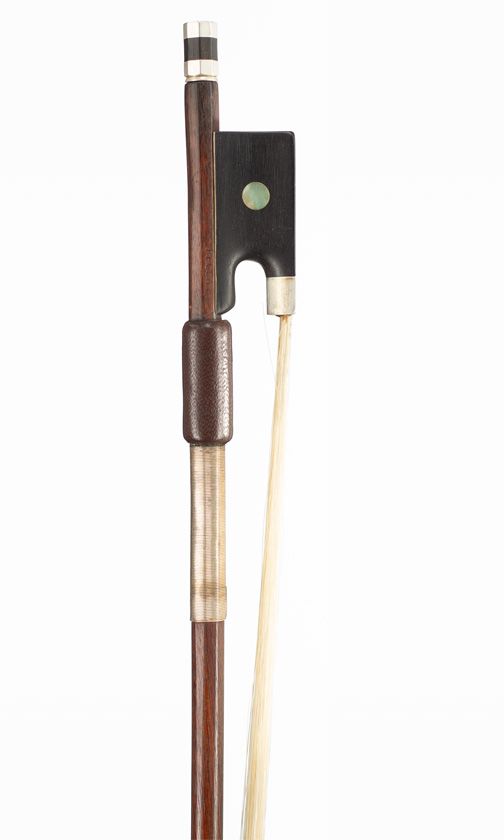 A nickel-mounted violin bow, branded Peccatte