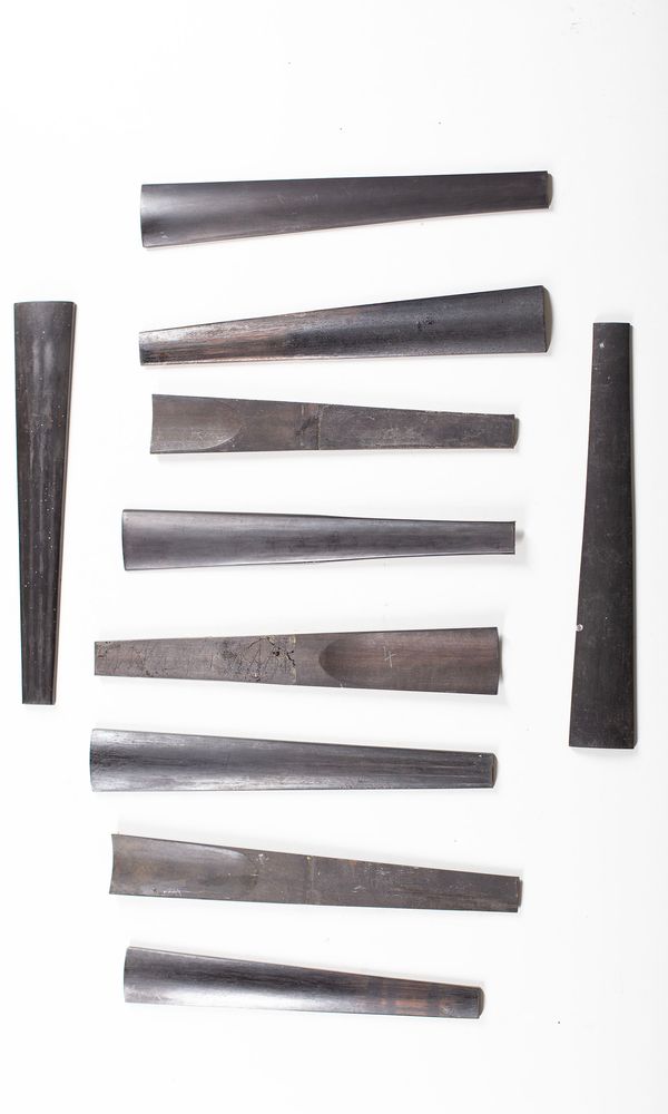 A bundle of ten used violin fingerboards
