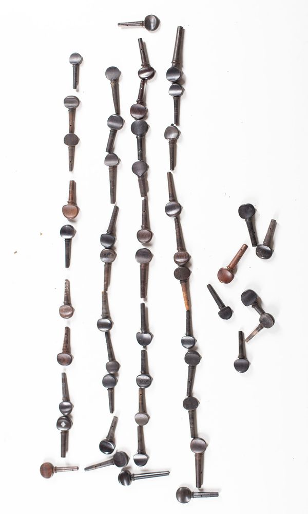 A bundle of fifty violin pegs, varying sizes