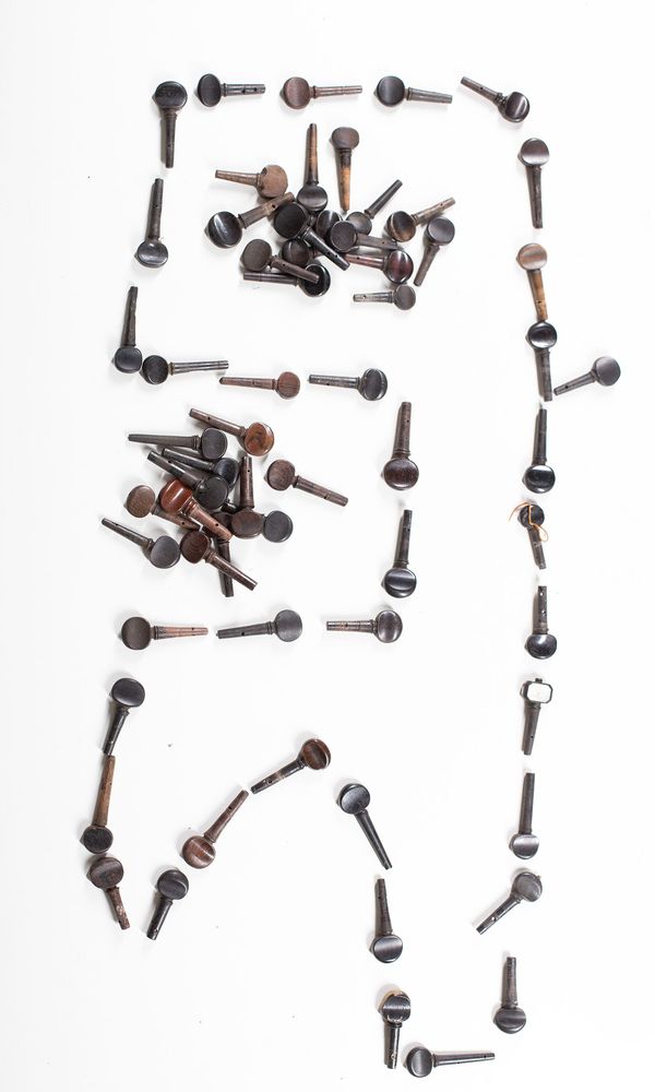 A bundle of one-hundred violin pegs, varying sizes