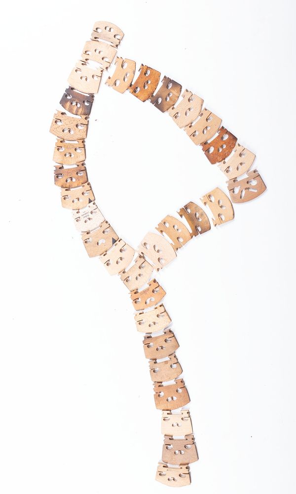 A bundle of one-hundred violin / viola bridges, varying sizes