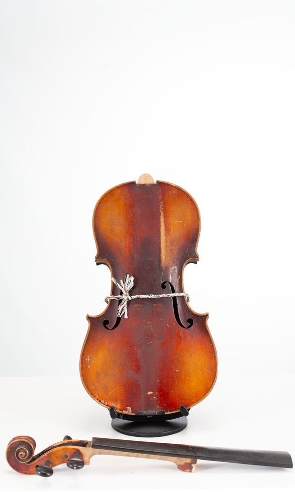 A broken violin, unlabelled