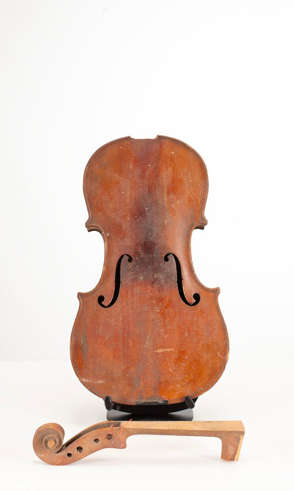A broken violin, labelled Antonio Stradivarius