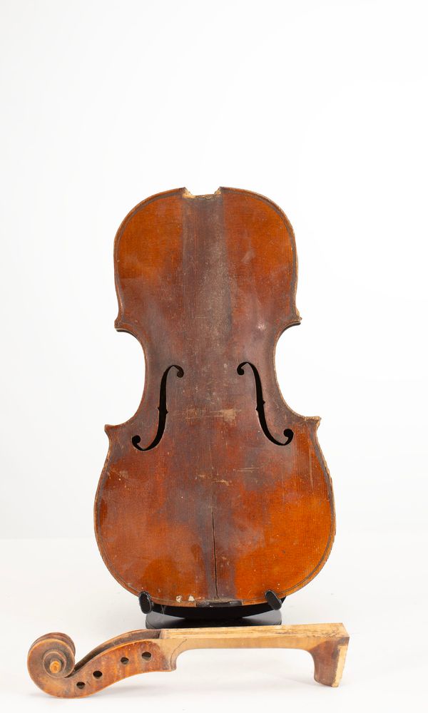 A broken violin, labelled Gebruder Hug