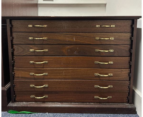 A bow cabinet with seven drawers