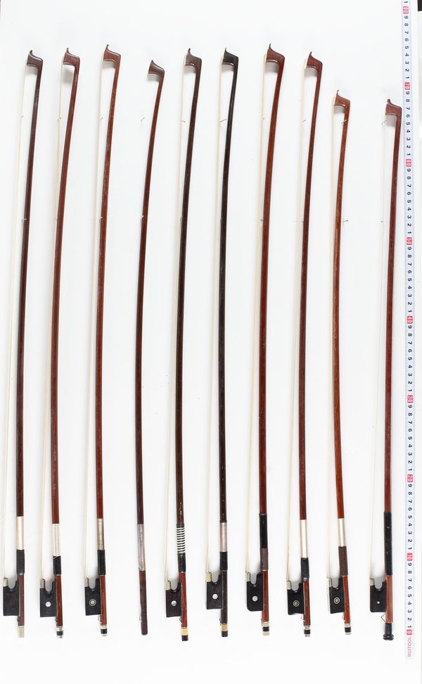 Twelve violin bows and three cello bows, varying lengths