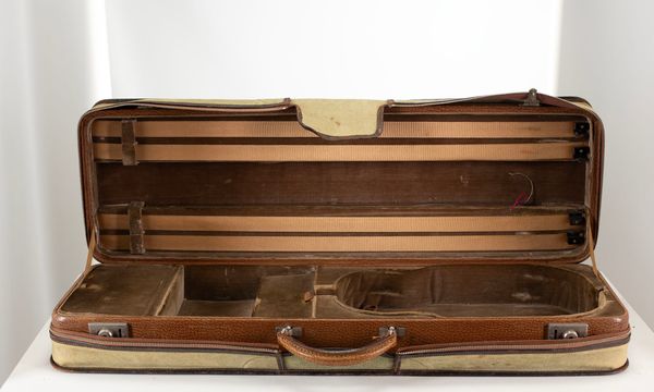 A violin case, branded W. E. Hill & Sons