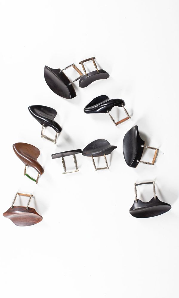 A bundle of nine chinrests, varying sizes