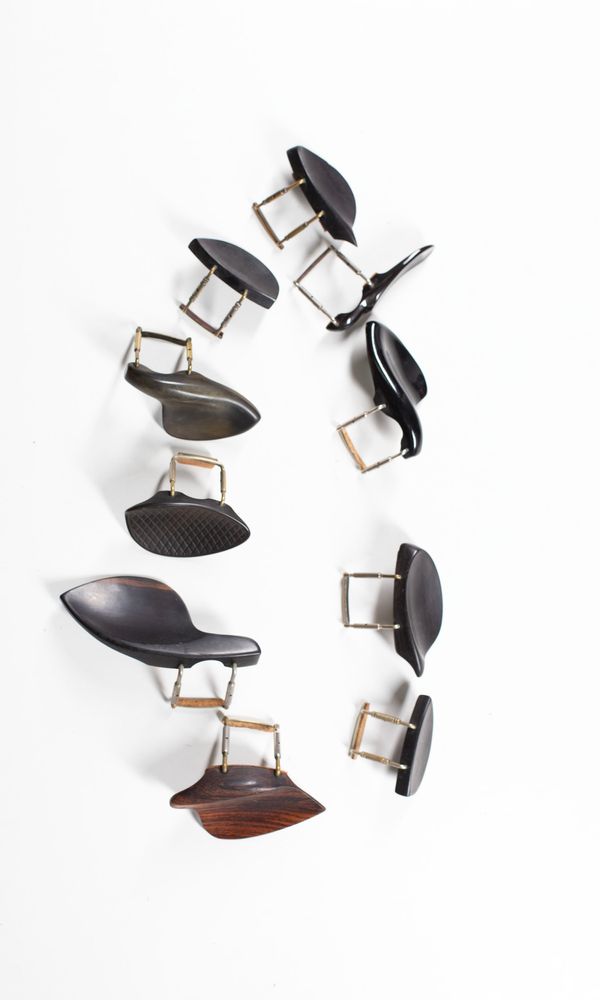 A bundle of ten chinrests, varying sizes