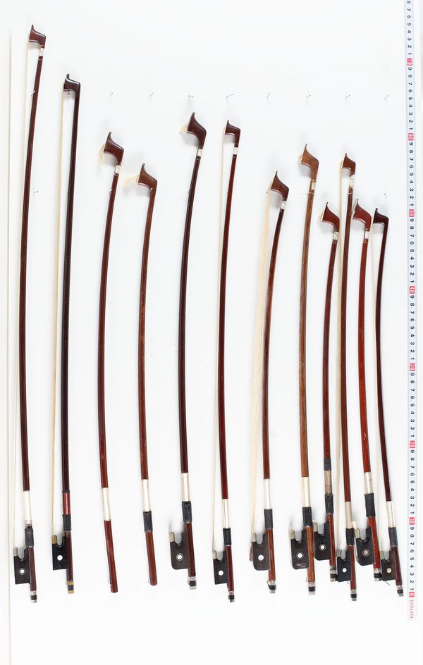 Six cello bows, six violin bows and two sticks, varying lengths