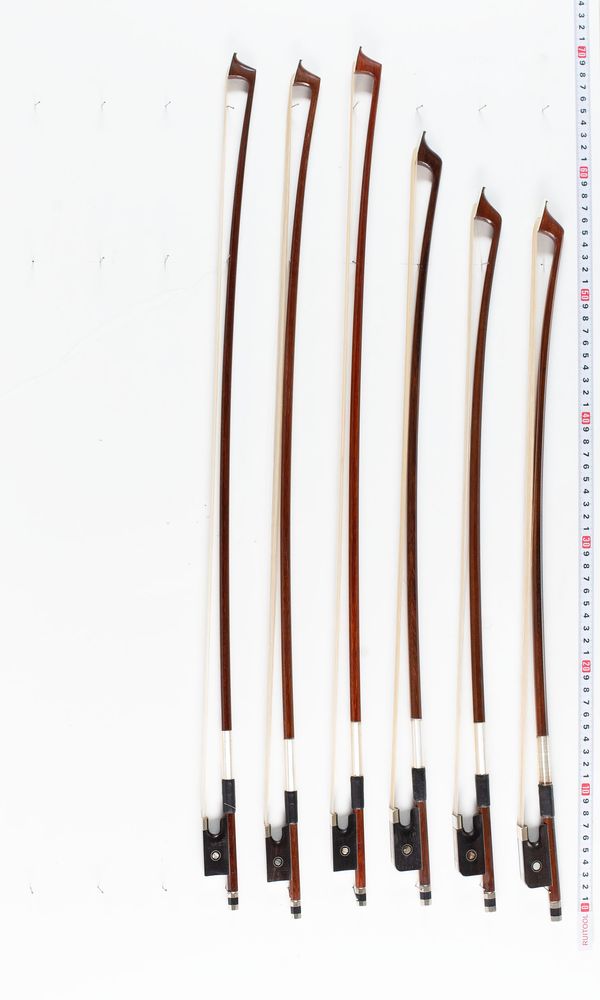 Three three-quarter violin bows and three small cello bows, varying lengths