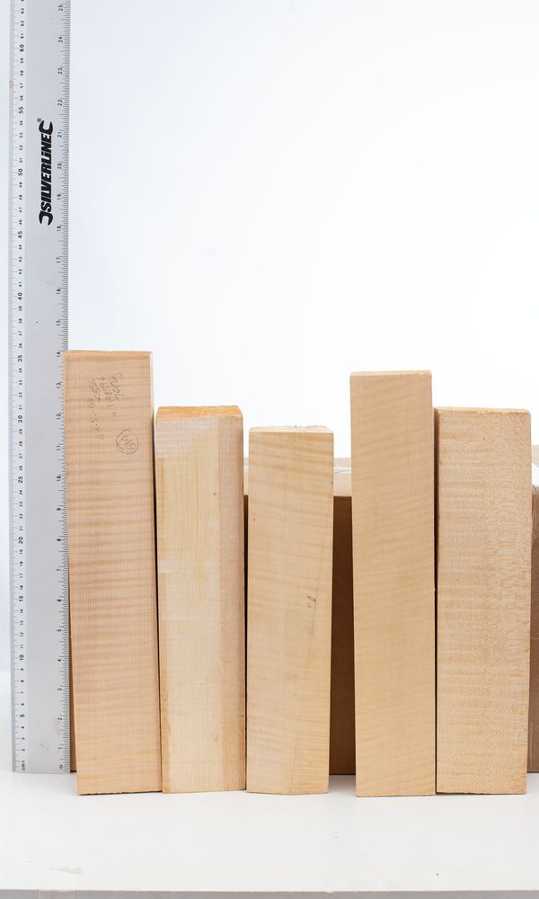 Seven violin neck blocks, maple