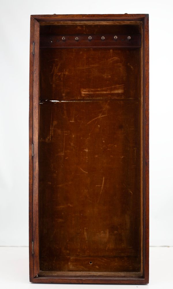 A mahogany bow display case