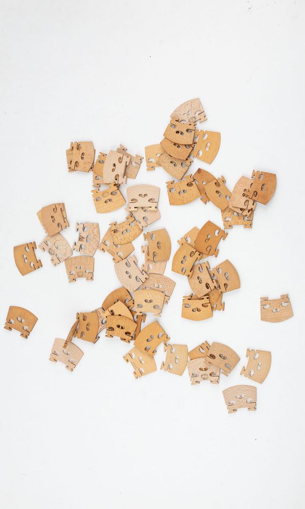 One-hundred and twenty violin bridges, varying sizes