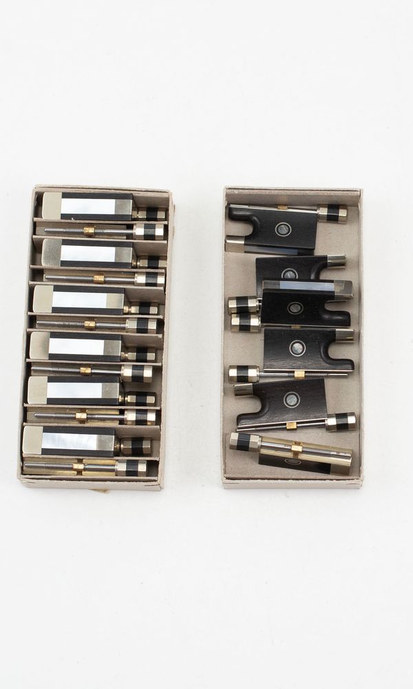 Eighteen violin frogs and adjusters