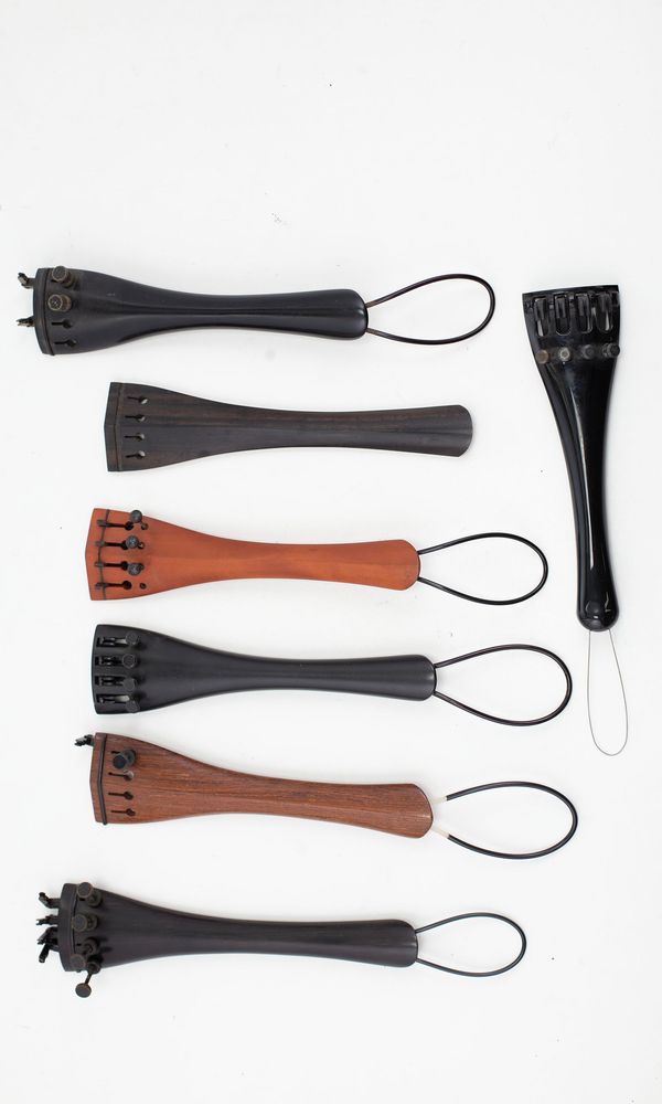 Six cello tailpieces